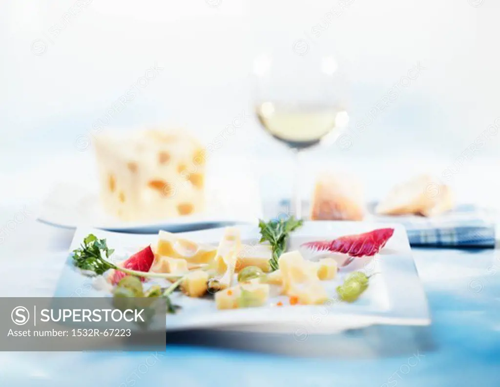 Pieces of cheese with grapes