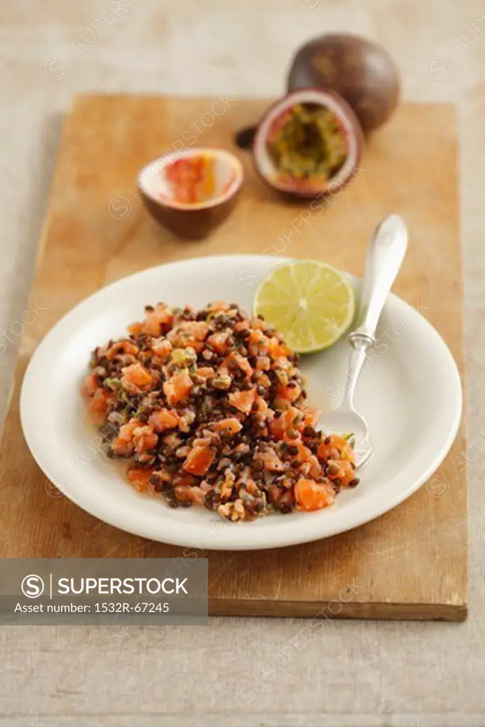 Smoked salmon tartar with black lentils and passion fruit