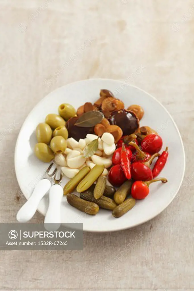 Various pickles - cucumbers, mushrooms, pepper, garlic, olives