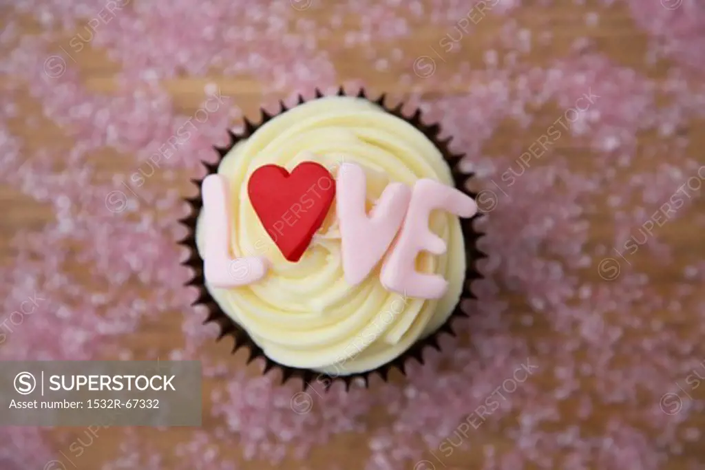 Chocolate cupcake with 'love' written on it