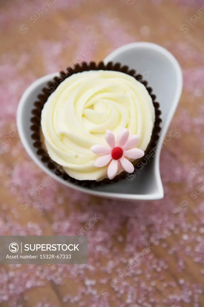 White chocolate cupcake in a heart-shaped dish