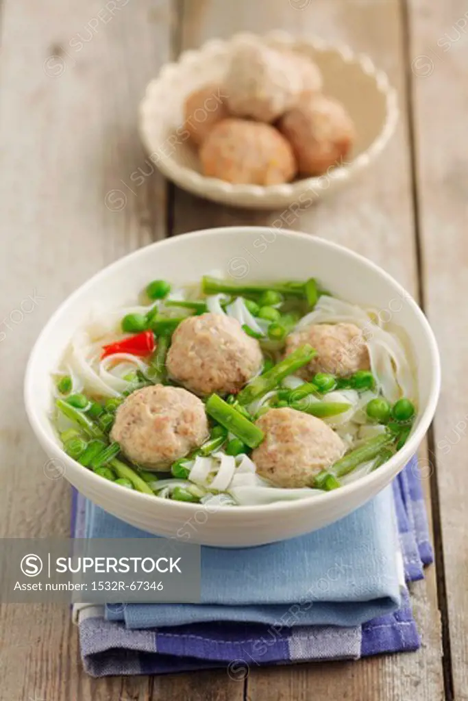 Soup with rice noodles and chicken meatballs