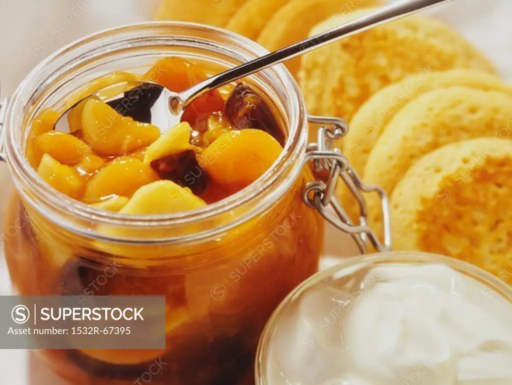Apricot compote with yogurt and little pancakes