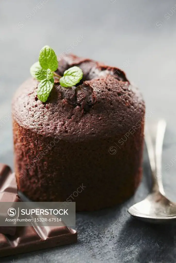 Chocolate souffle with mint leaves