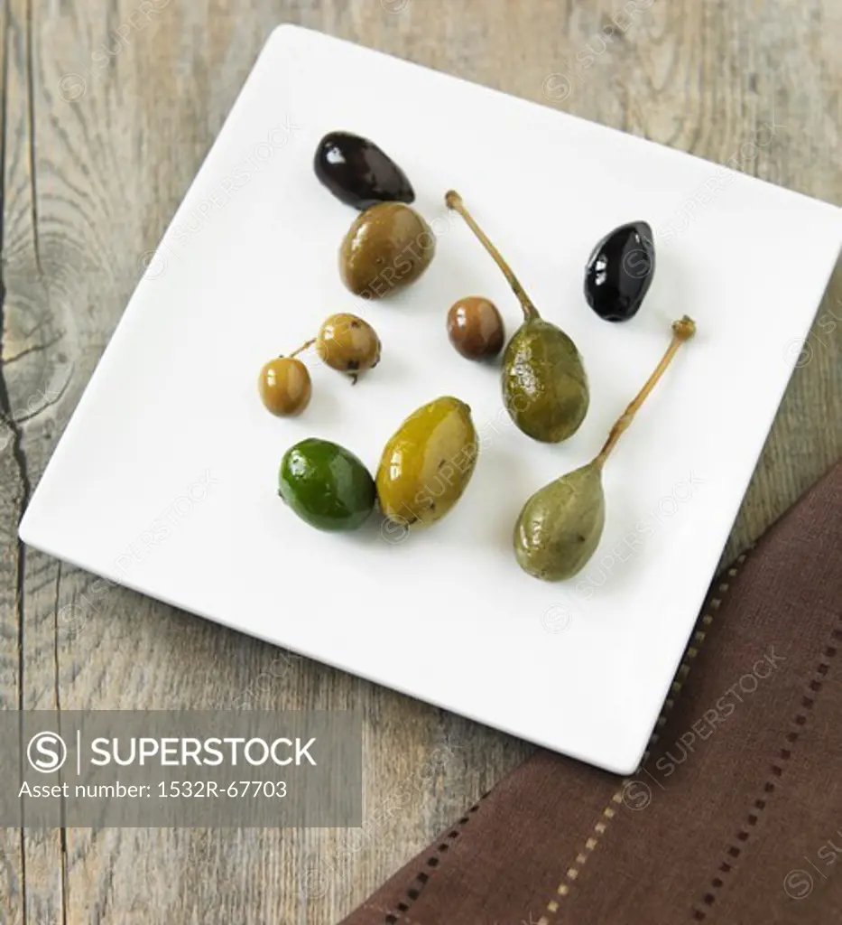 An Assortment of Olives on a White Plate