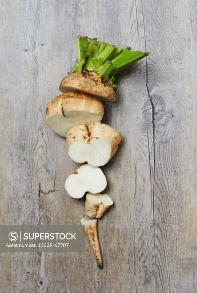 A Sliced Raw Sugar Beet on a Wooden Surface