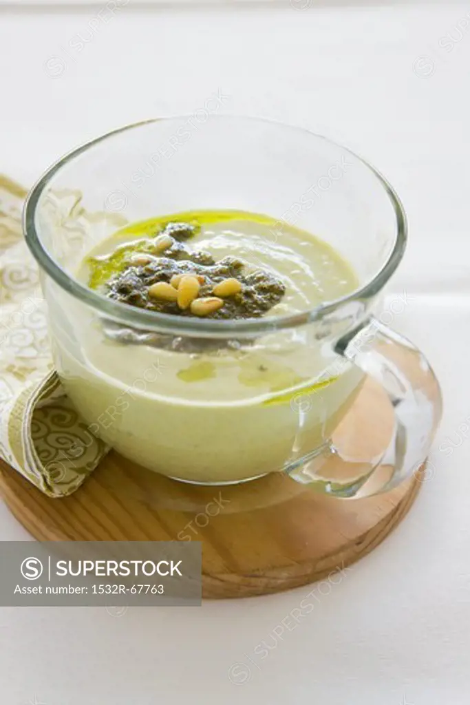 Cream of asparagus with pesto and pine nuts
