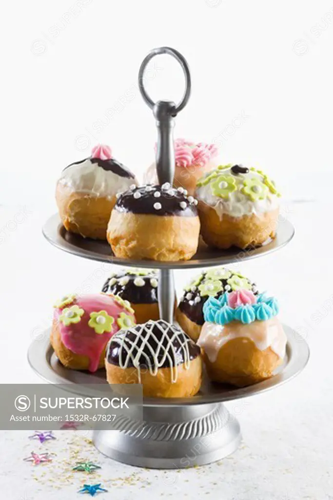 Assorted doughnuts for Hanukkah on a tiered cake stand