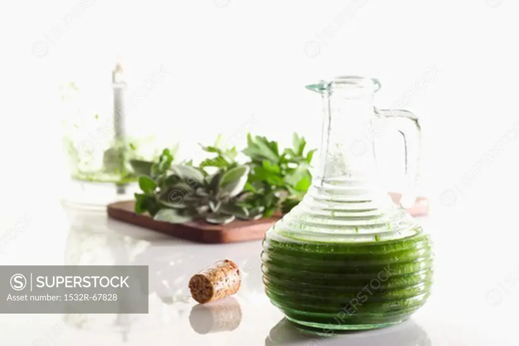Olive oil with herbs in a jug