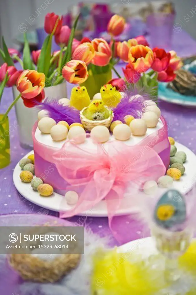 Spring Easter Simnel cake with baby chick and ribbon