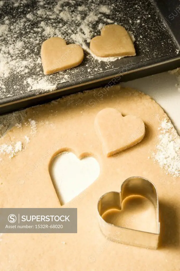 Cutting out heart-shaped biscuits