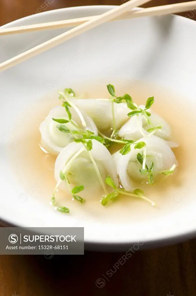 Edamame Dumplings in a Bowl of Broth with Chopsticks