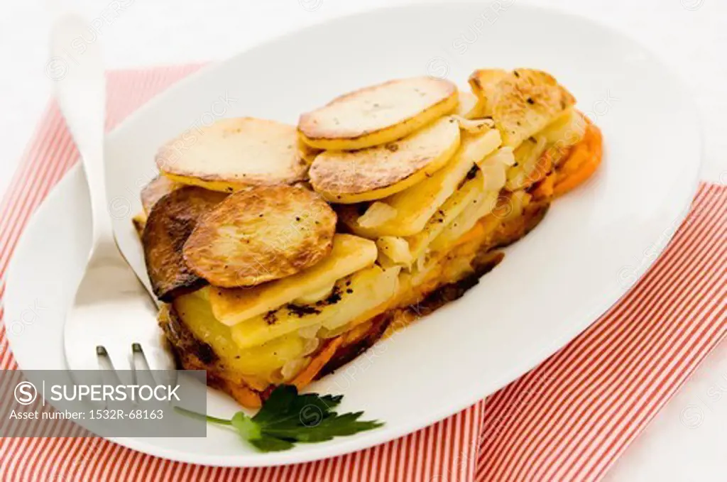 A Piece of Sweet Potato and White Potato Pie on a White Plate