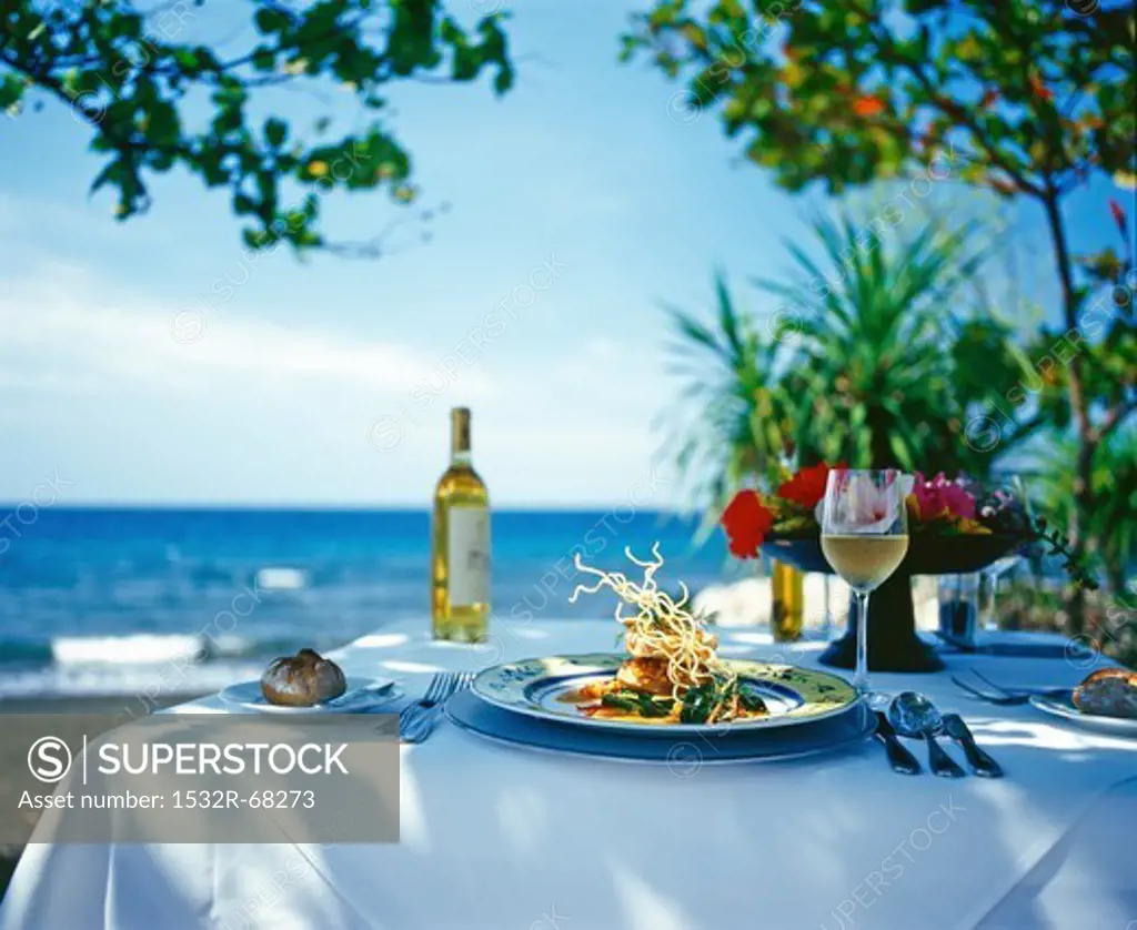 A table laid for a meal by the sea in Bali
