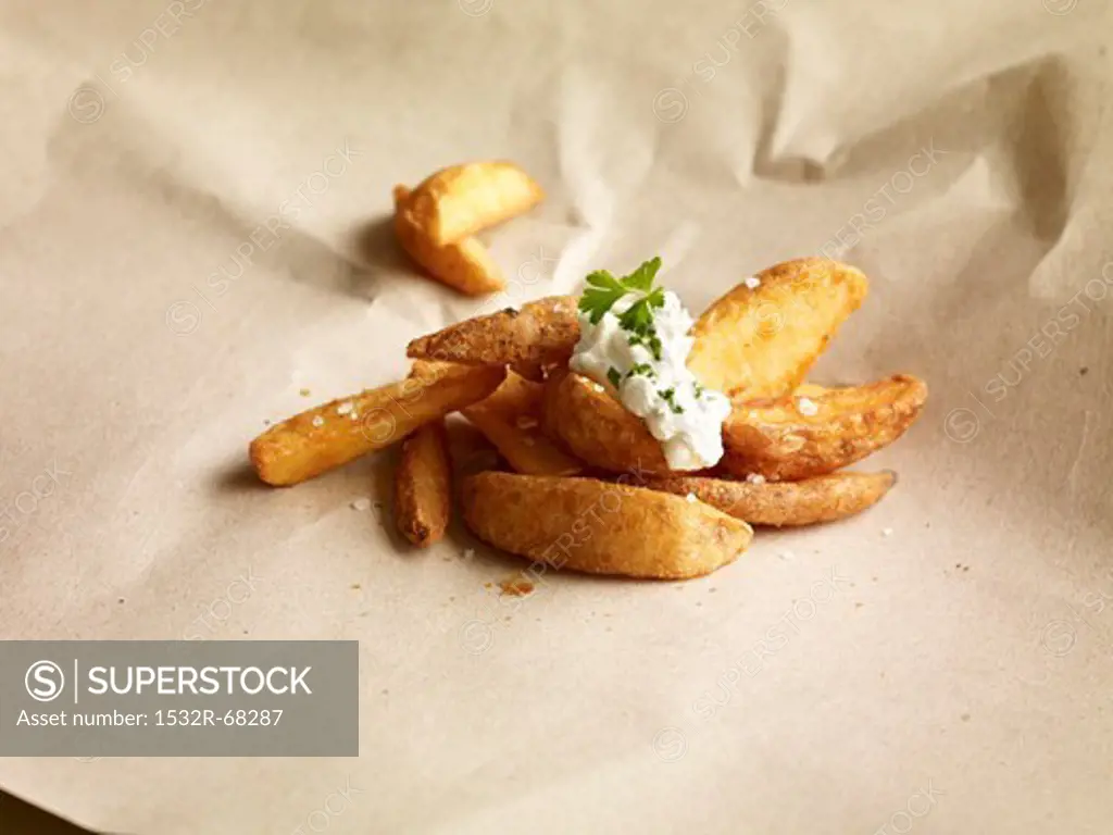 Potato wedges topped with herb dip