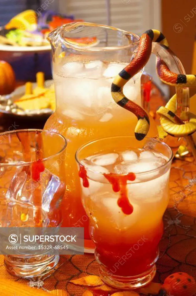 Halloween Punch in a Pitcher and Glasses; Snake on the Pitcher Handle