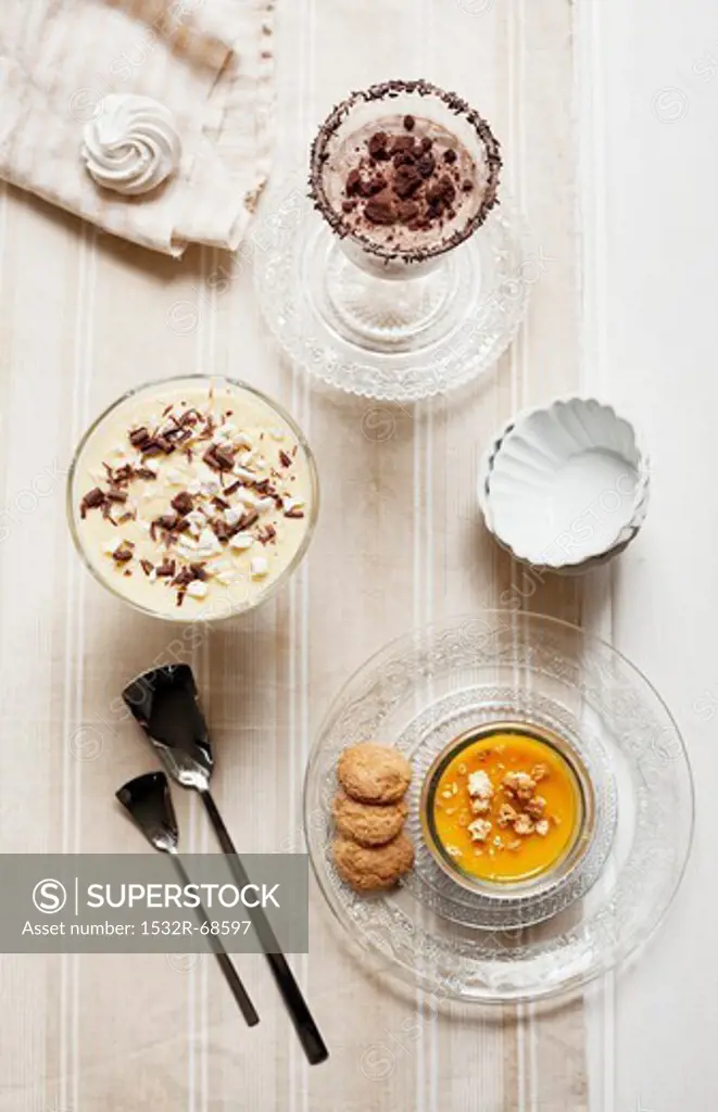Pumpkin cream with amaretti biscuits, muscatel cream with meringue pieces, and coffee and ricotta cream with chocolate biscuit pieces