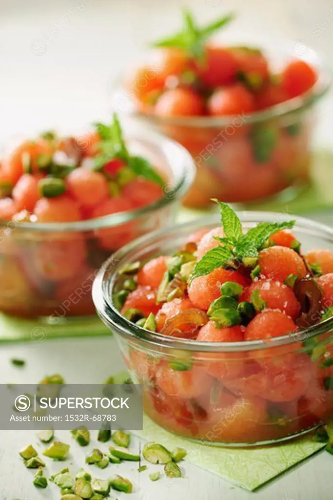 Watermelon and Date salad with roasted pistachios, selective focus
