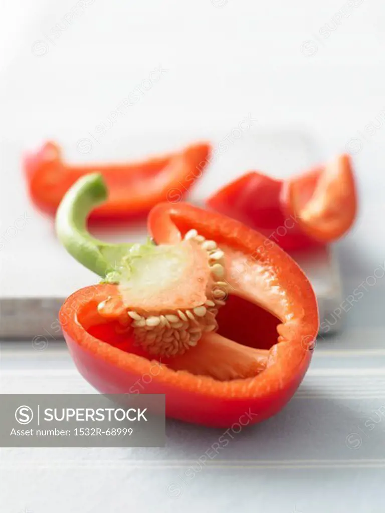 A red pepper, sliced open