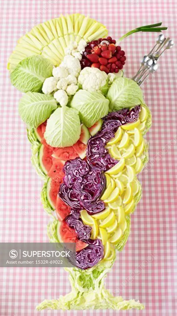 An ice cream sundae made from vegetables, fruit and lettuce