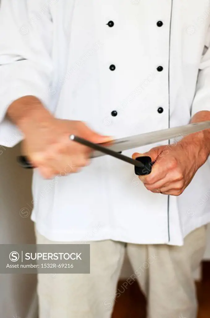 A Chef Sharpening a Knife