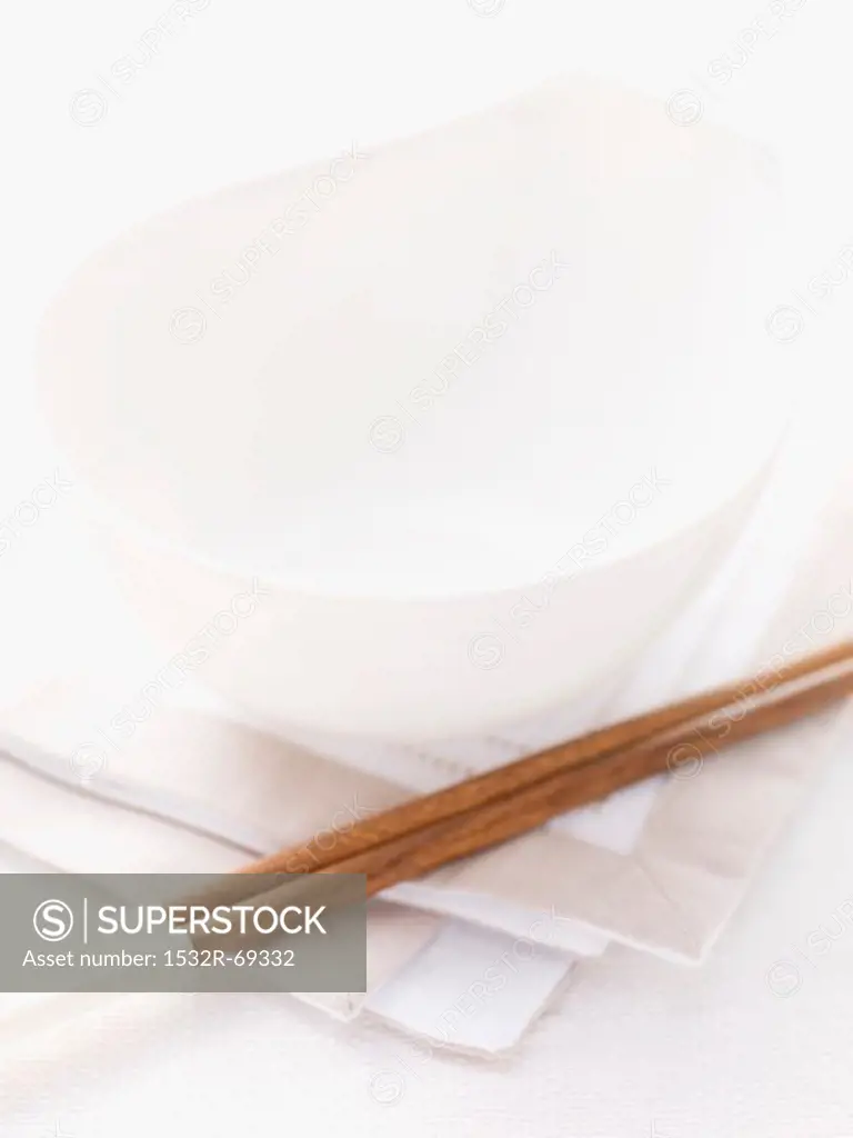 Table setting with bowl and chopsticks on a napkin (Asia)