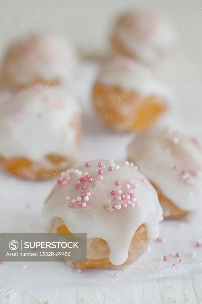 Doughnuts with sugar glaze and sugar sprinkles