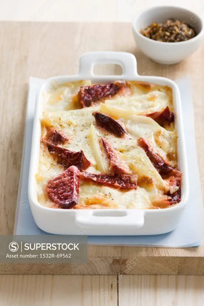 Potato and beetroot gratin in a casserole dish