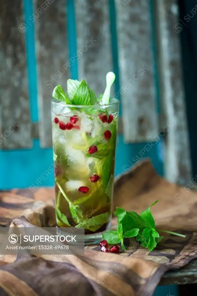 Ginger beer cocktail with mint and pomegranate