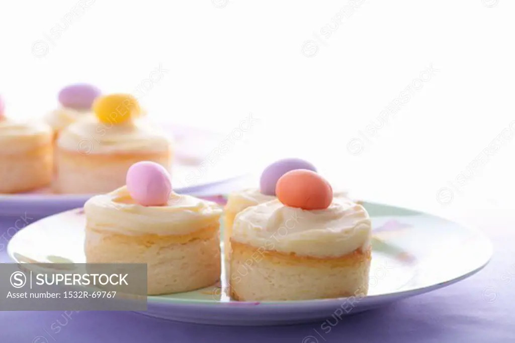 Mini cheesecakes with vanilla custard and marzipan eggs