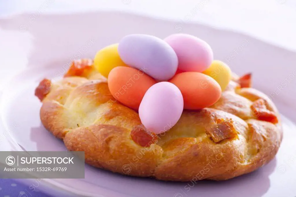 Yeast doughnut with marzipan eggs (close-up)