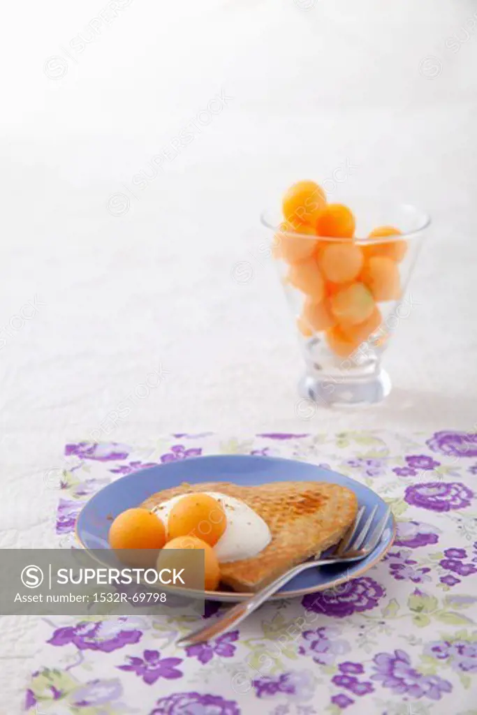 Pancake with yoghurt and melon balls
