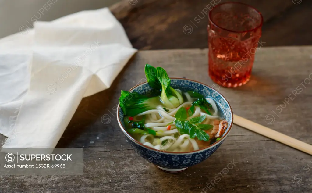 A Small Bowl of Korean Noodle Soup with Bok Choy