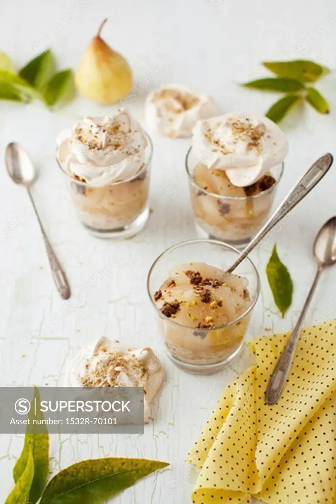 Pear Dessert Topped with Meringues in Glasses with Spoons