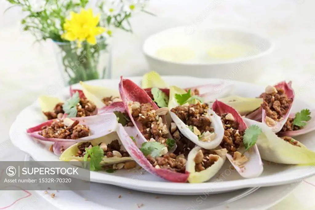 Thai dish of seasoned pork in salad leaves