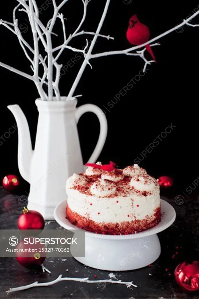 Red Velvet Cake on a Pedestal Dish with Christmas Ornaments