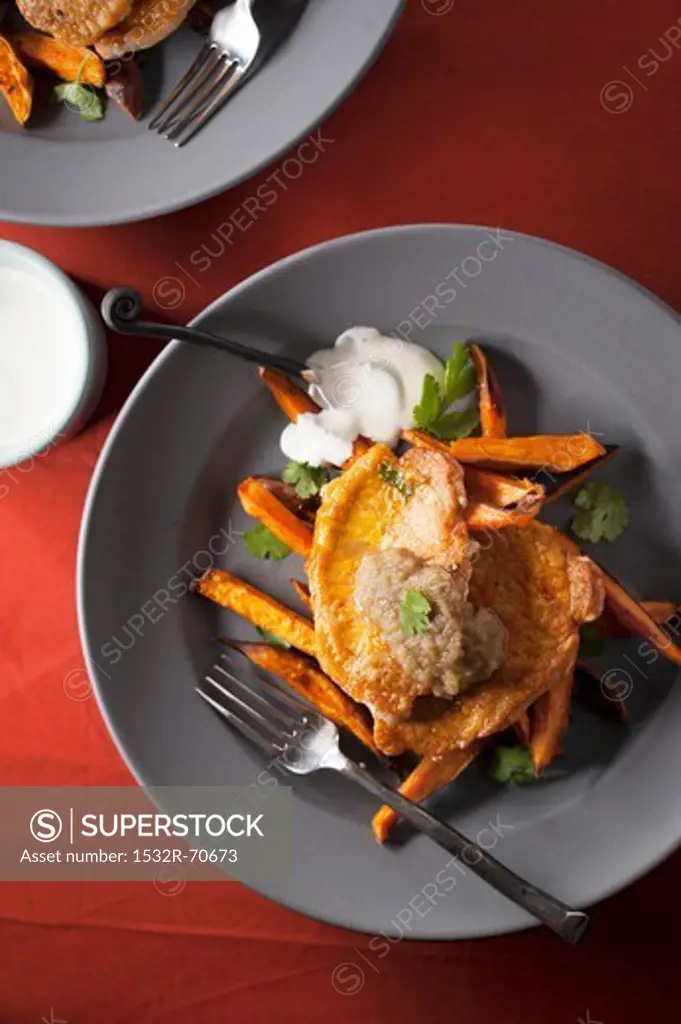Fried Pork Cutlets on Sweet Potato Fries Topped with Pureed Ginger and Apples