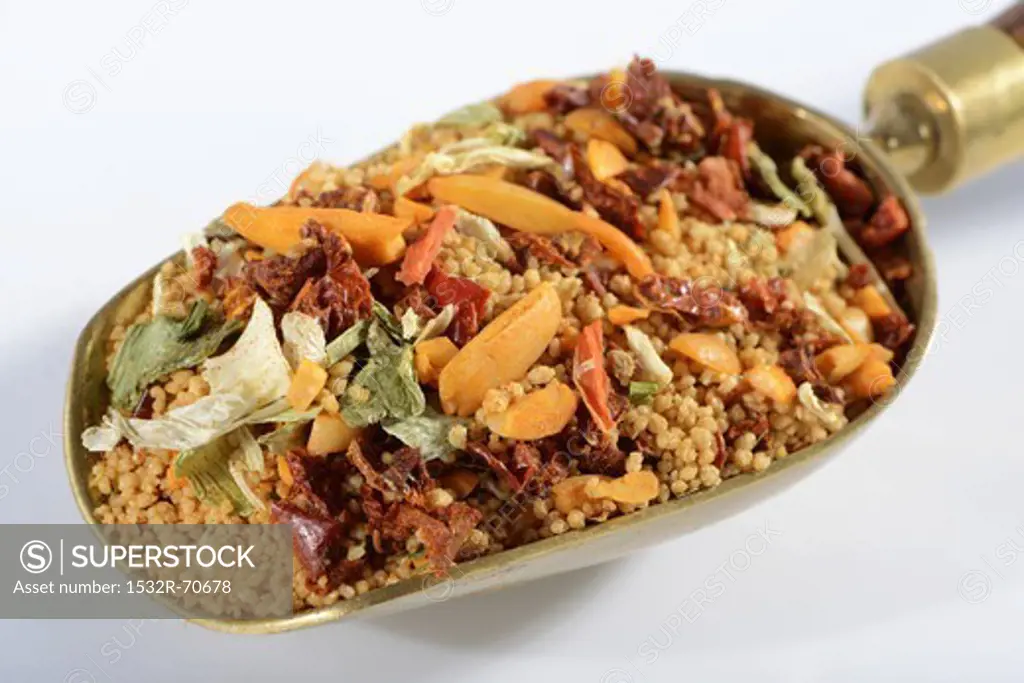 Couscous and ingredients in a scoop
