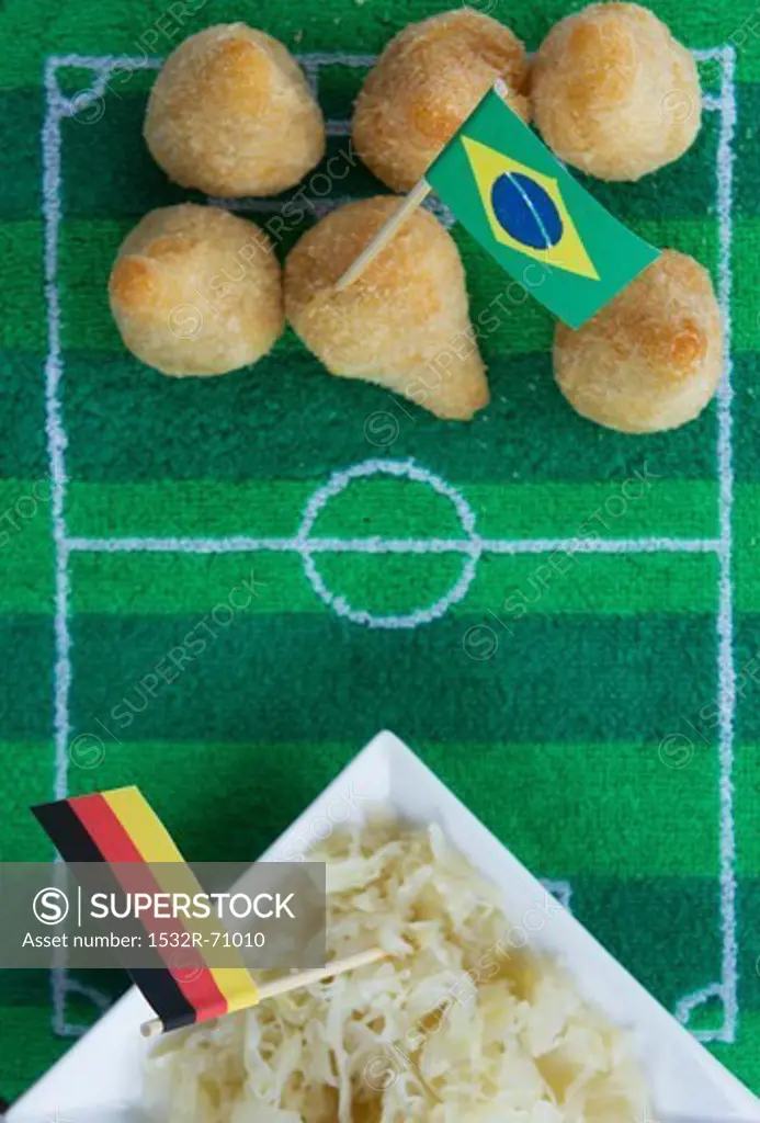 Salgadinhos (Brazil) and sauerkraut (Germany) with football-themed decoration