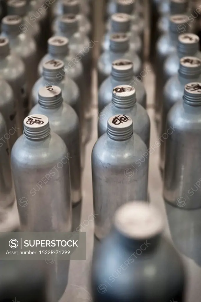 Rows of Metal Bottles with French Writing