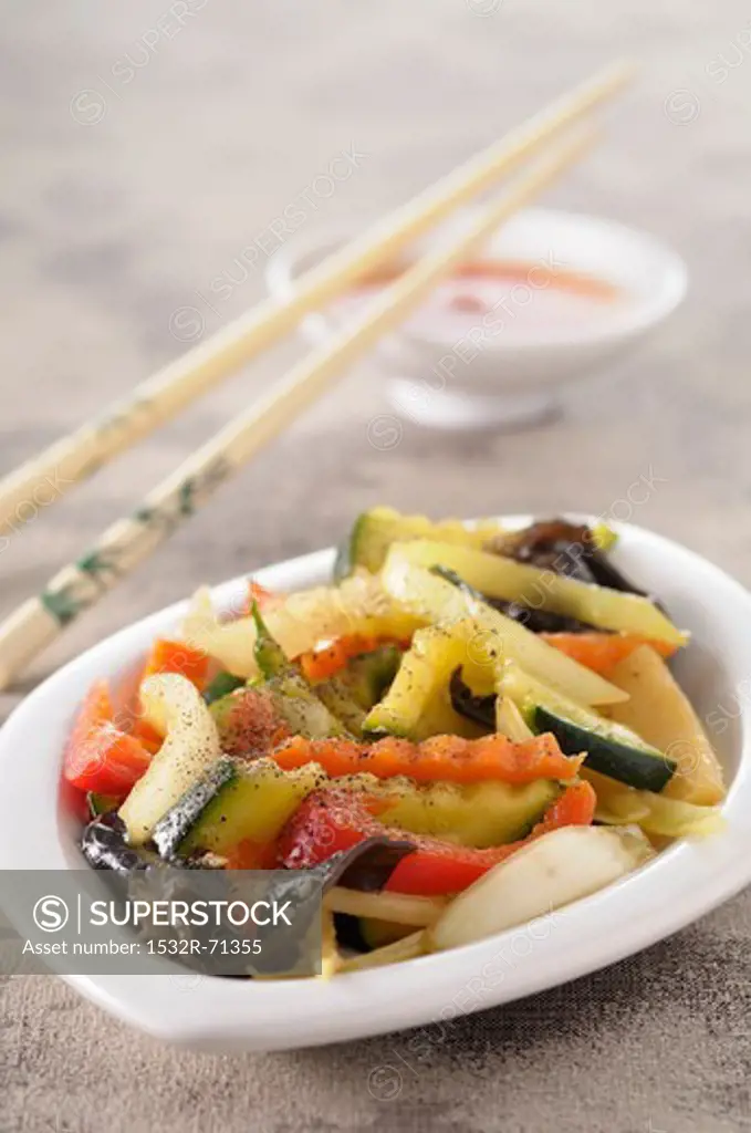 Chop Suey in a small bowl with chopsticks