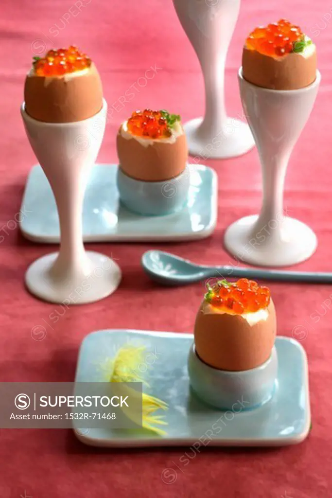 Soft-boiled eggs with caviar in eggcups