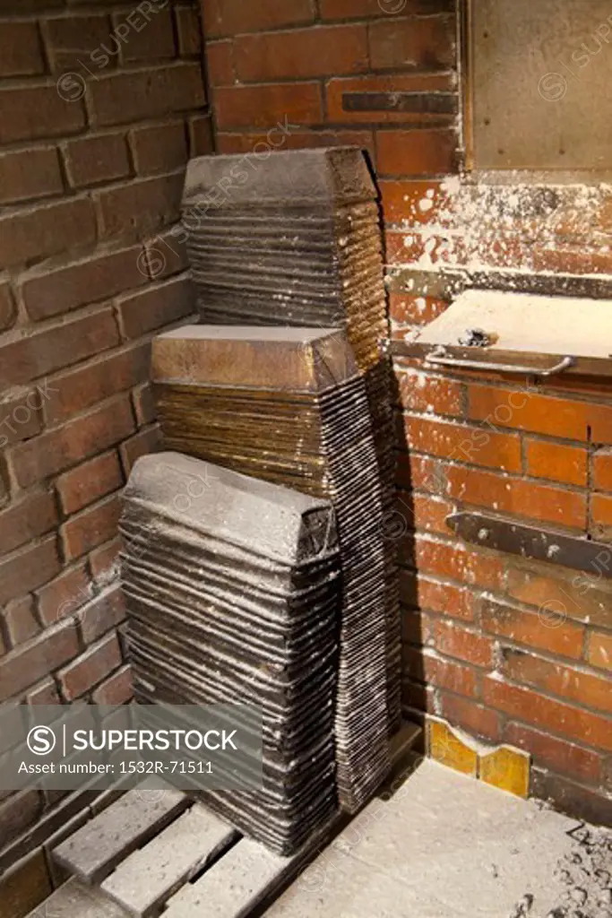 Stacked loaf tins in a bakery