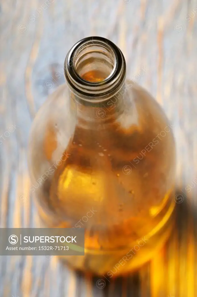 A bottle of white wine, opened