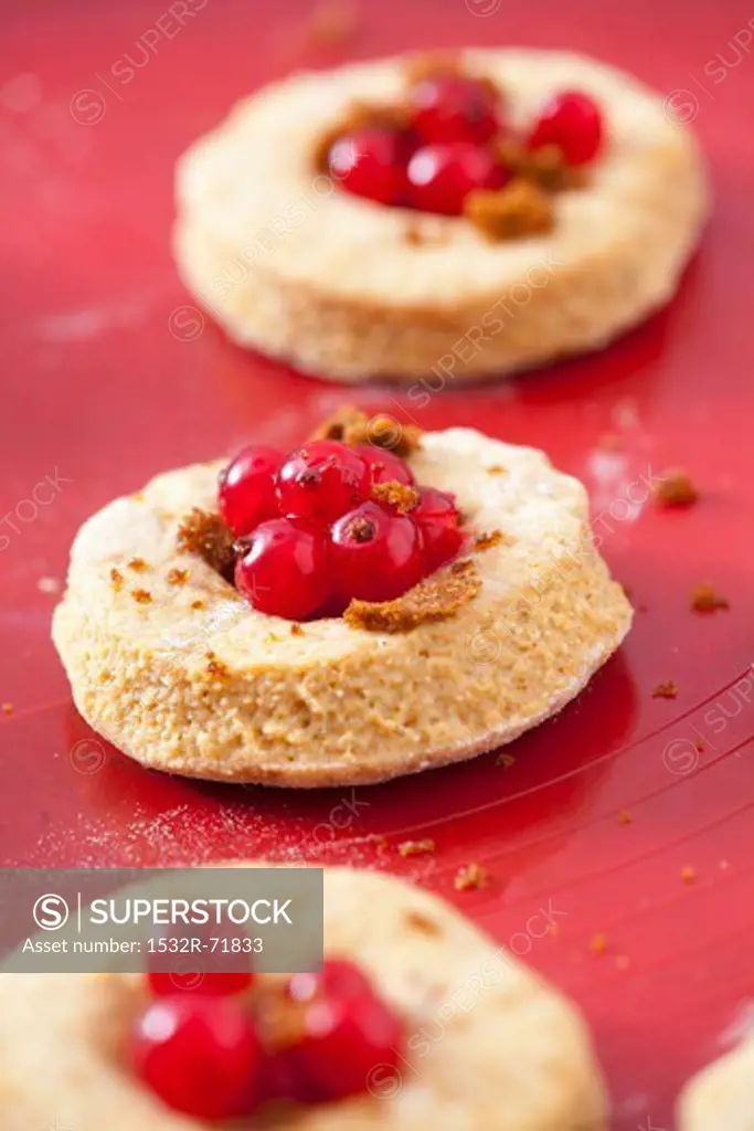 Unbaked wholemeal scones with redcurrants