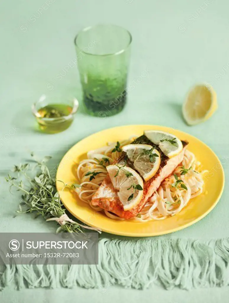 Salmon fillet on noodles with lemon sauce