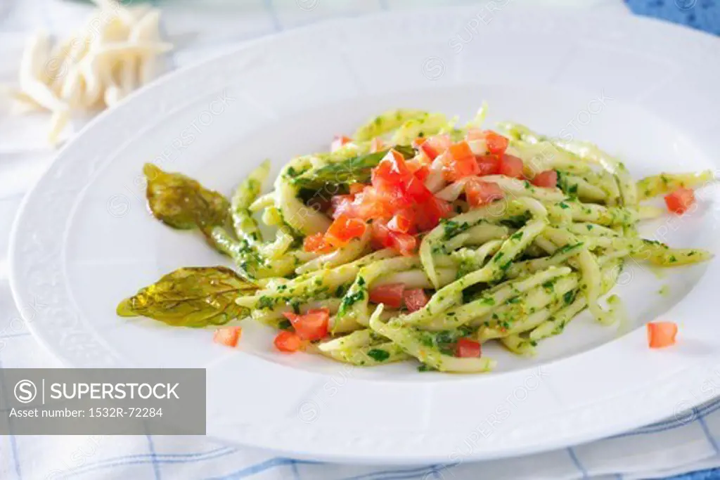 Trofie pasta with pesto and tomatoes