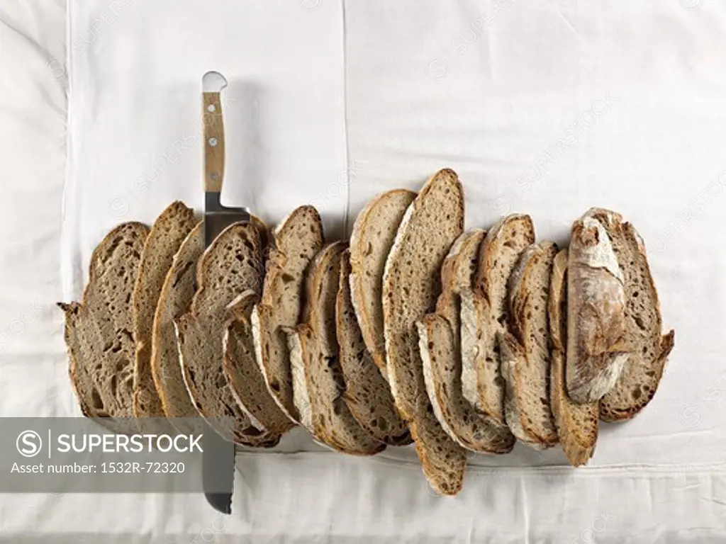 Slices of brown bread made from mixed rye and wheat flour, lined up together