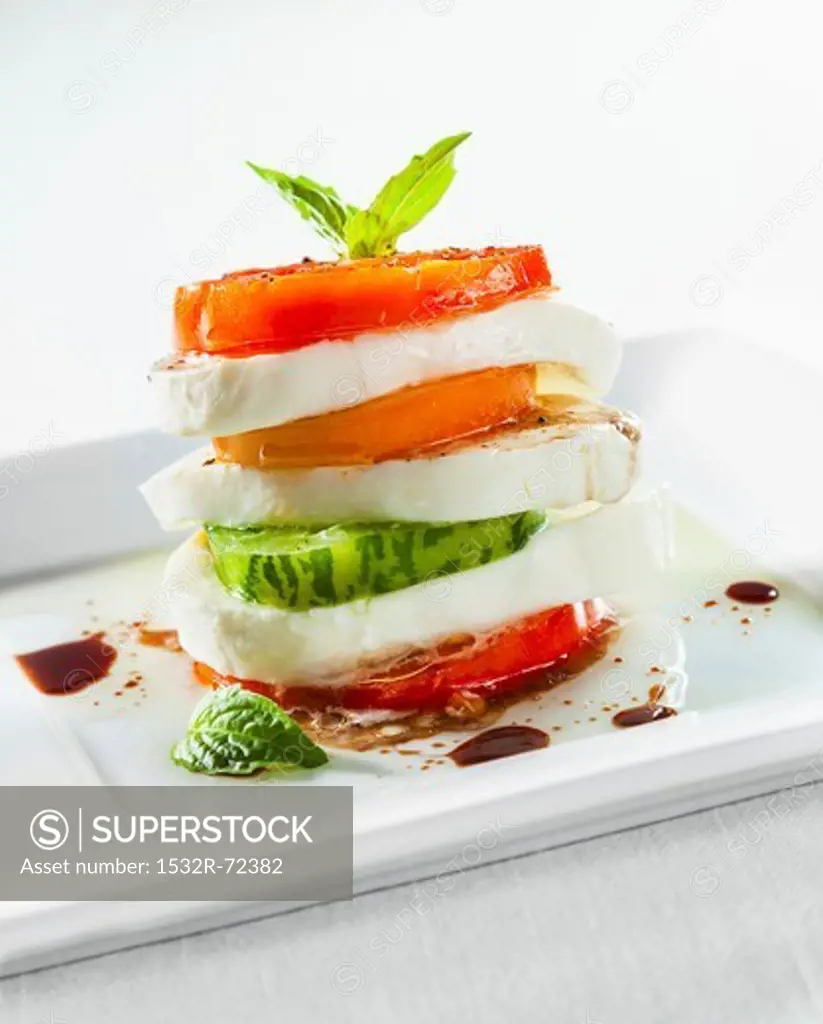 Stacked Caprese Salad with Fresh Mozzarella, Heirloom Tomatoes, Basil, Olive Oil and Balsamic Vinegar