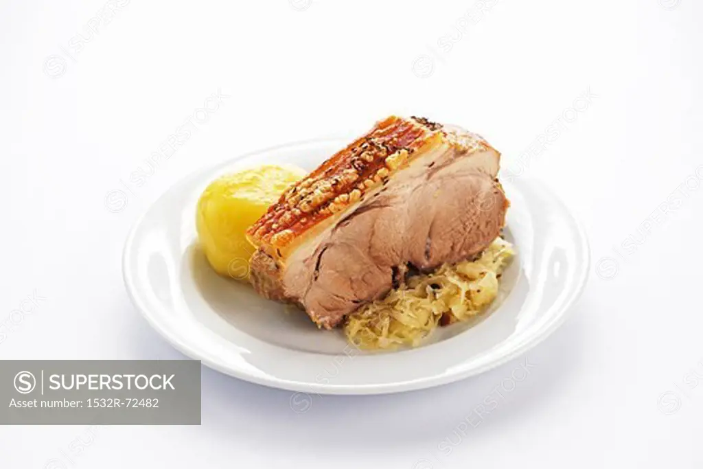 Roasted shoulder of pork with potato dumplings and sauerkraut